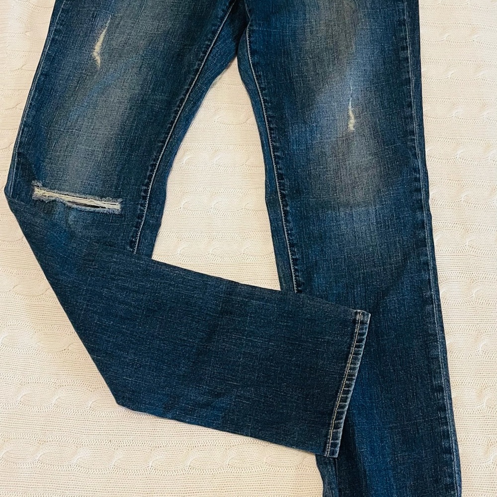 Distressed denim jeans